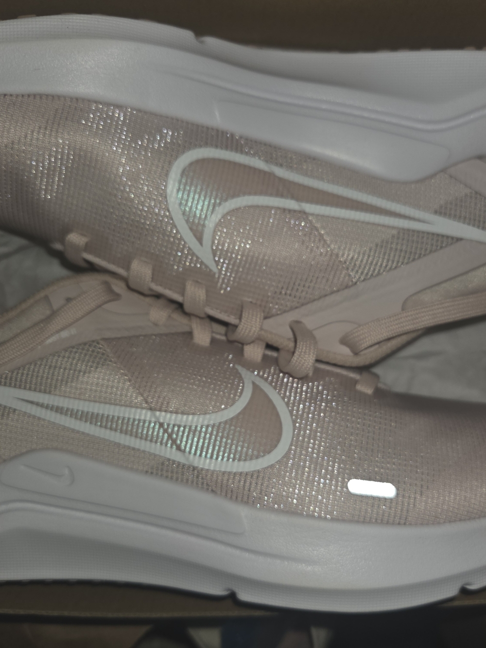 Nike Women's Light Pink Athletic Running Shoes with White Swoosh